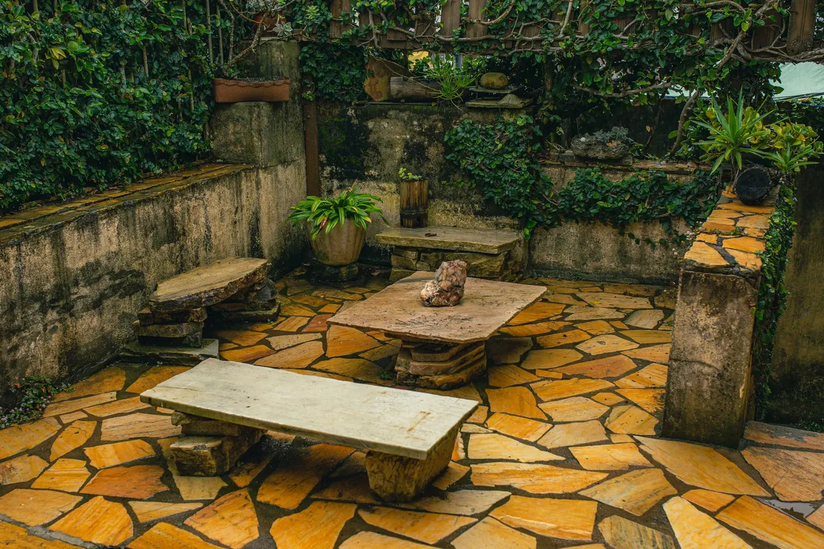 Warm flagstone patio with a rustic stone table