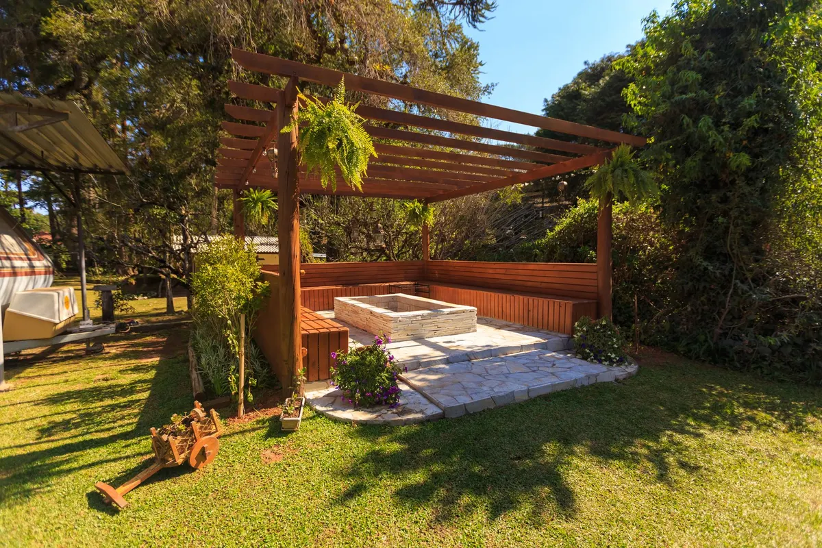 Backyard pergola and seating area at dusk