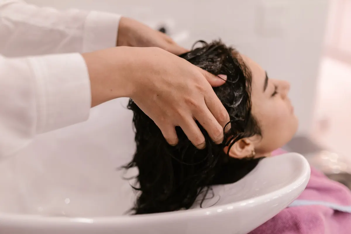 Relaxing scalp massage during a salon hair wash